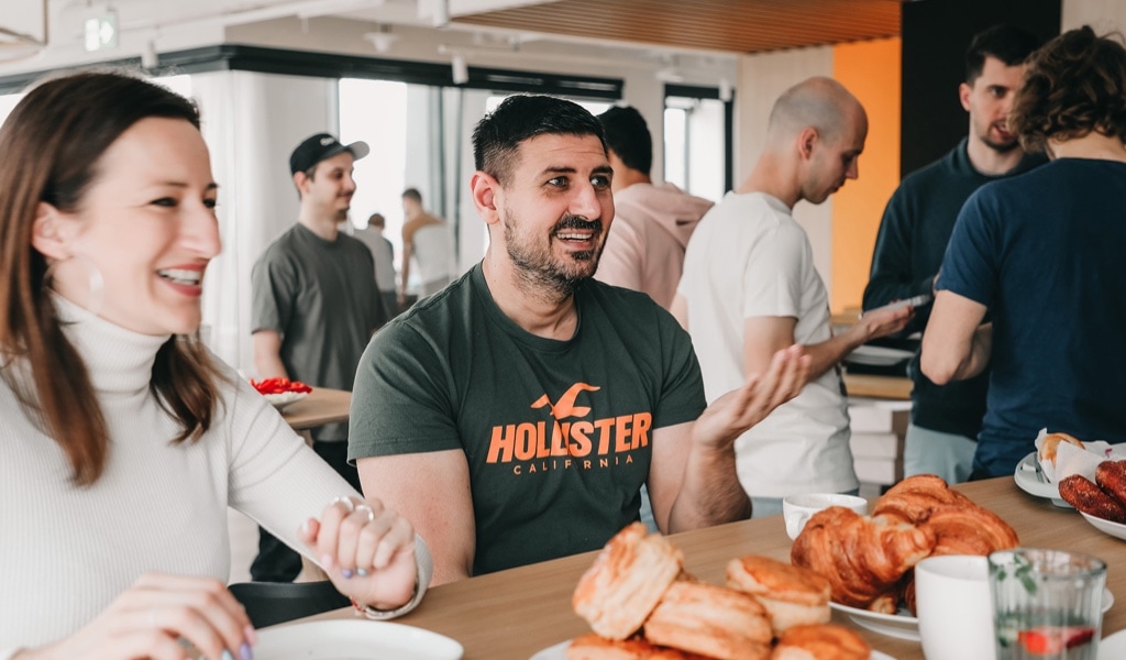 Two team members enjoying breakfast