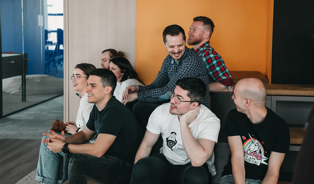 Team members in Christmas apparel during a presentation