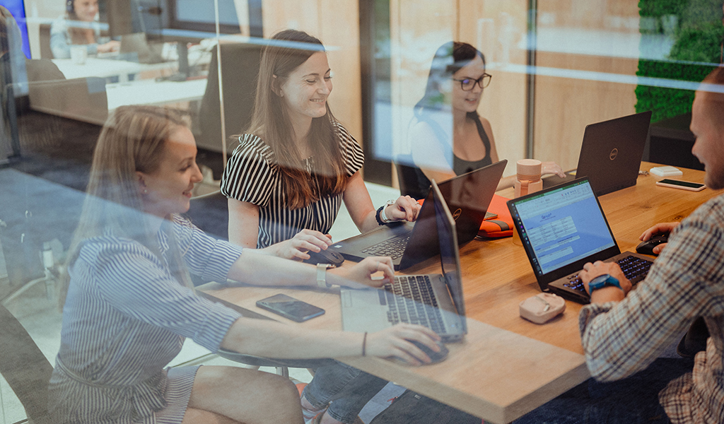 Three members of the recruiting team during a meeting in a focus room