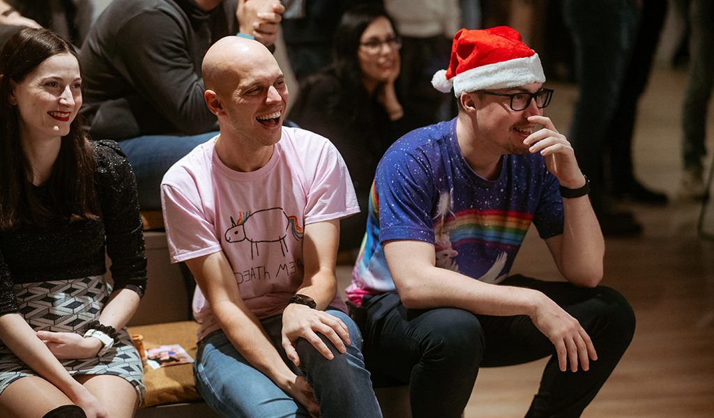 Team members of GoHealth laughing during the Christmas party