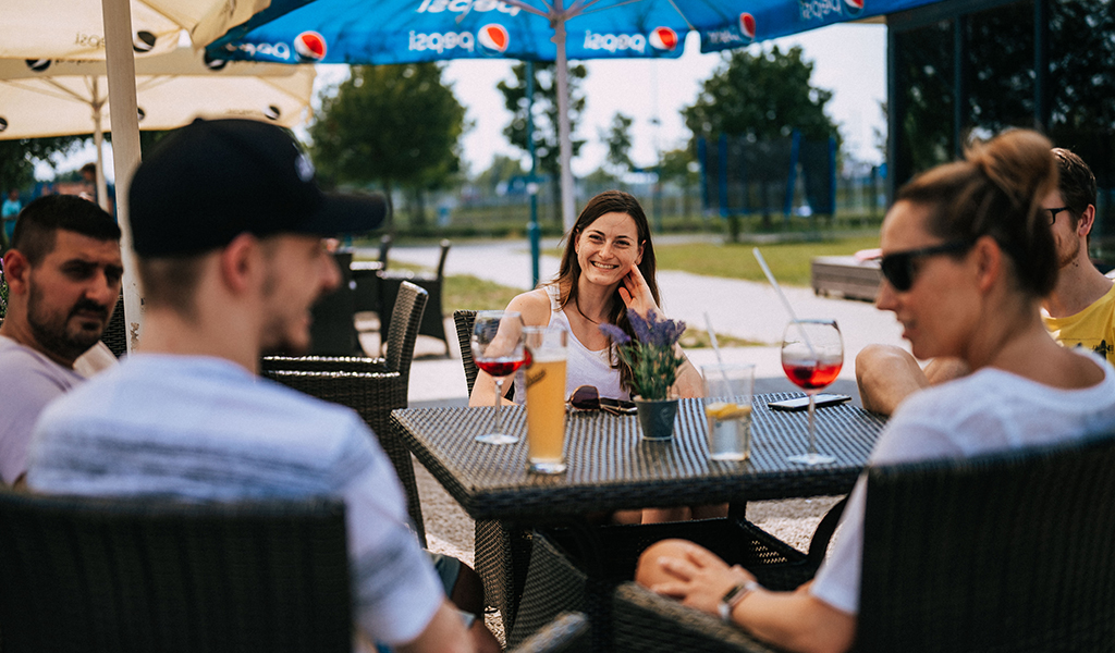 Team members chatting and having drinks