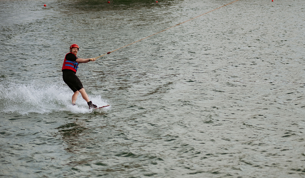 Man on a wakeboard on a lake