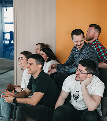 Team members in Christmas apparel during a presentation