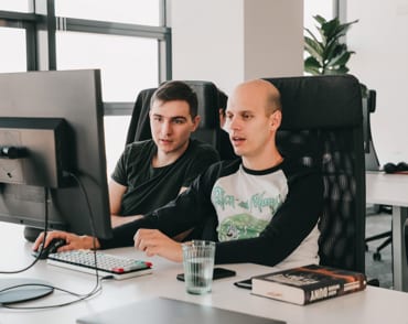 Two Software Engineers collaborating on a task