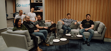 Team members chatting in the office kitchen