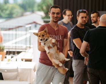 Team members of GoHealth one of them holding a dog