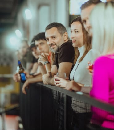 Team members watching go karts