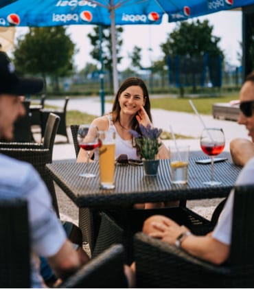 Team members chatting and having drinks