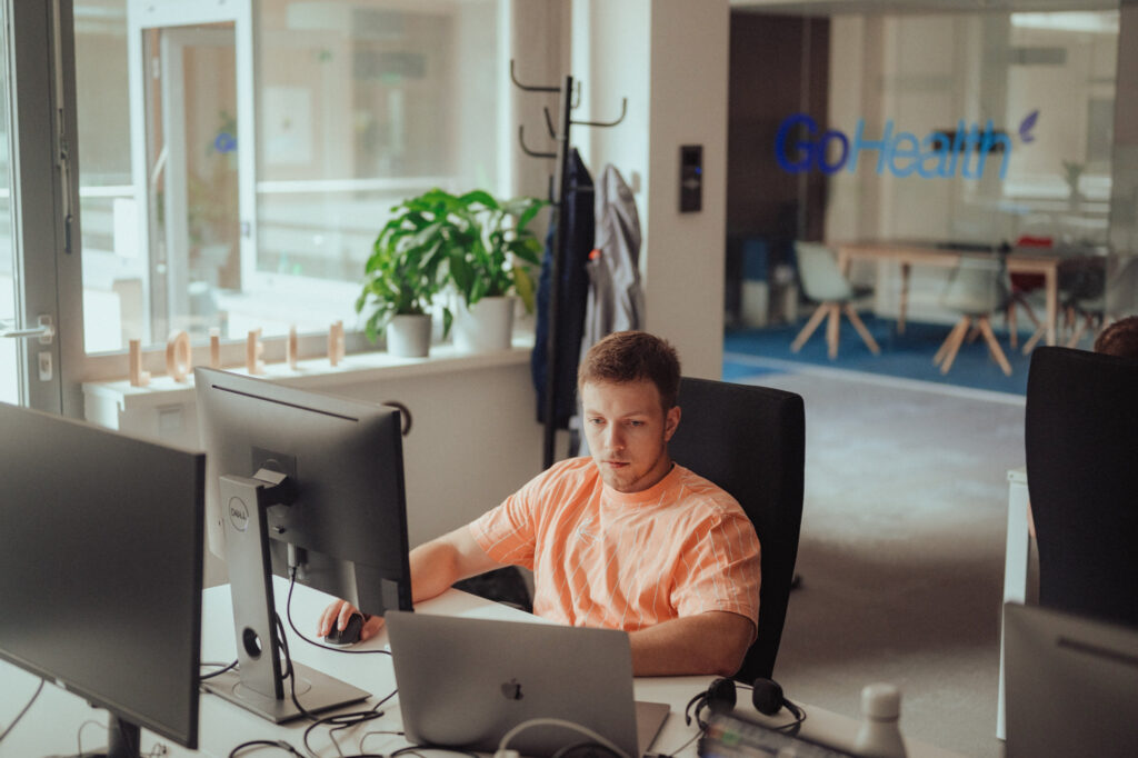 A developer working on his computer in the office.