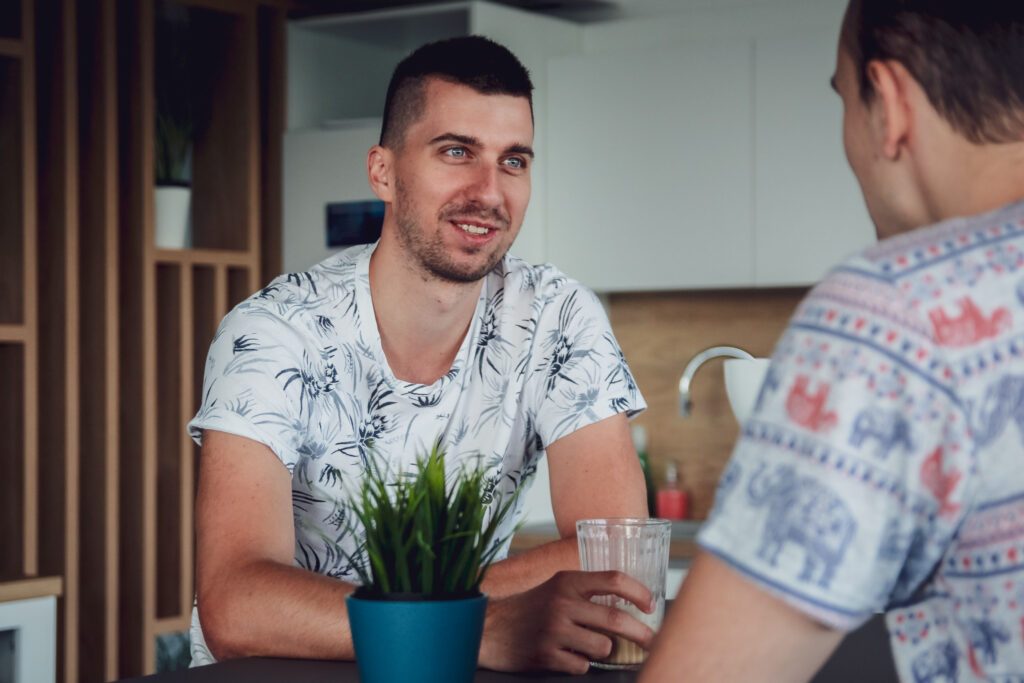 Colleagues during their conversation in the office kitchen.