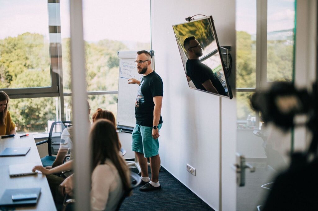 Software Engineer giving a presentation using a flipchart.