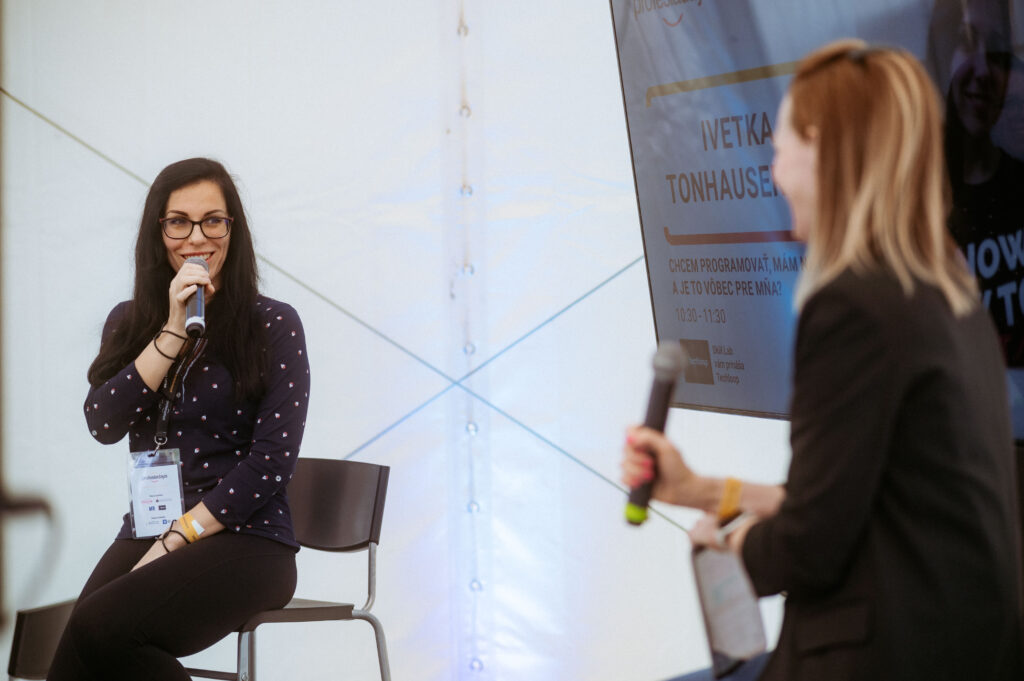 woman giving presentation on stage