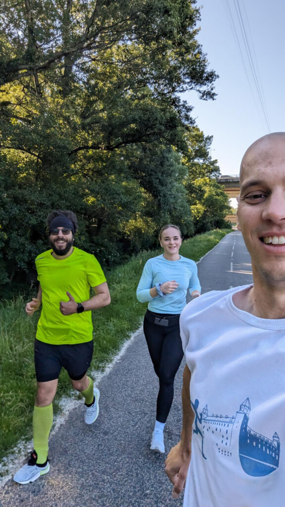 two men and one women on a morning run