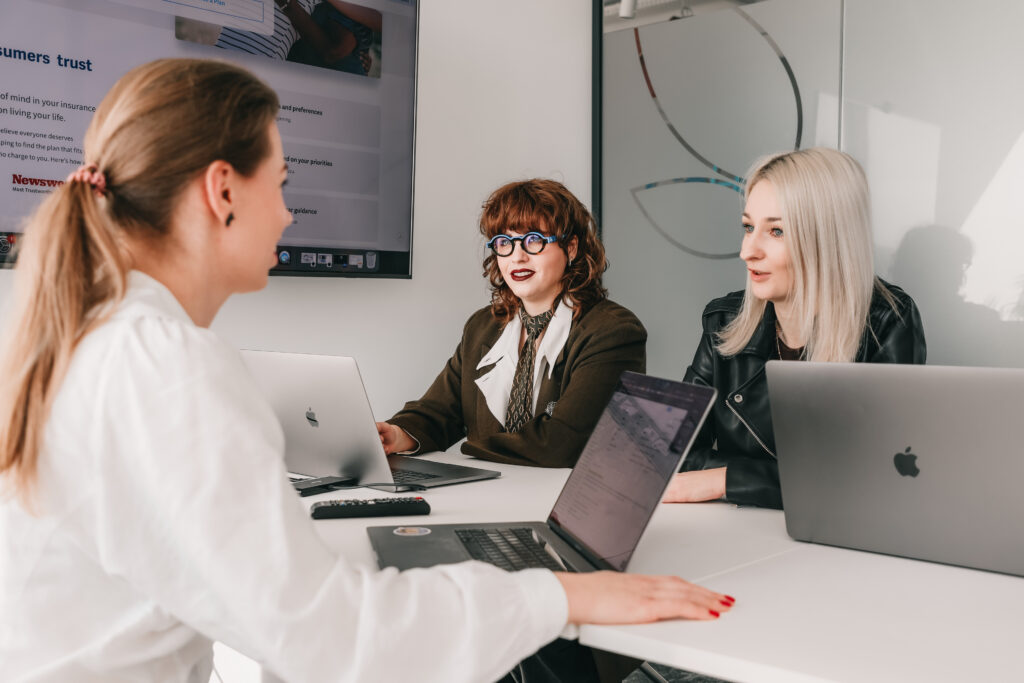 three female project managers brainstorming during a meeting